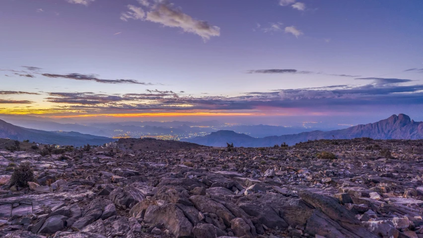 a picture of the view of some mountains from a high altitude peak