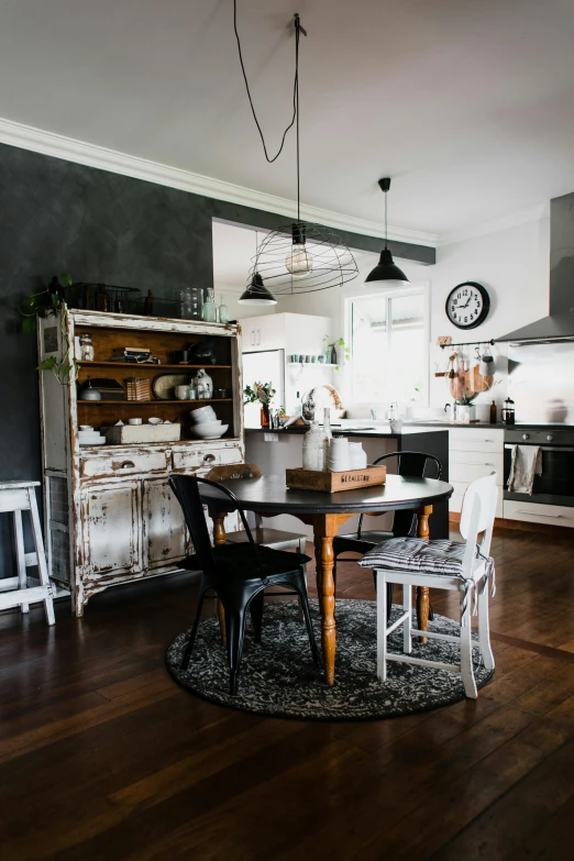 kitchen with dining room table and old furniture in middle