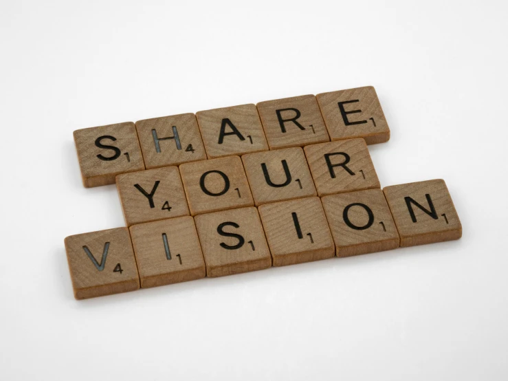the words share your vision written on scrabble tiles
