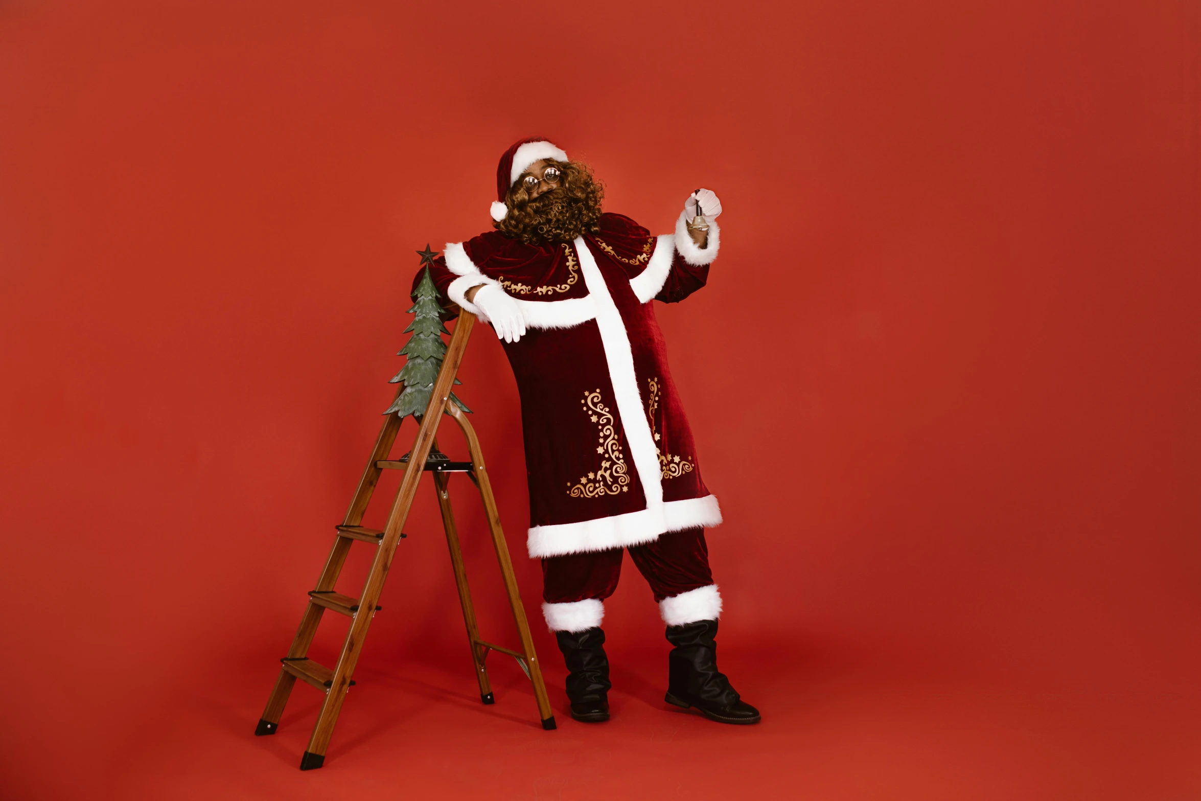 santa clause in red suit and ladder holding beer bottle