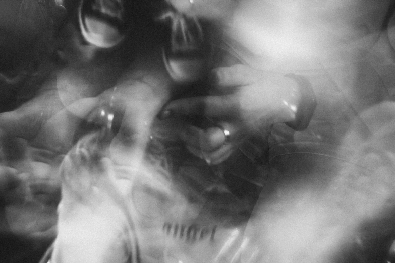 a black and white photo of a group of people, inspired by Germaine Krull, unsplash, lyrical abstraction, gloves and jewelry. motion, translucent sss xray, pov camera looking into the maw, captured in bottles