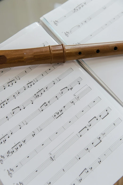 an orchestra pen resting on sheet music