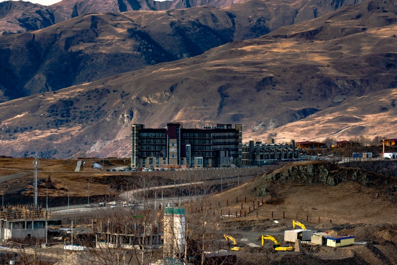 a large building on the side of a hill