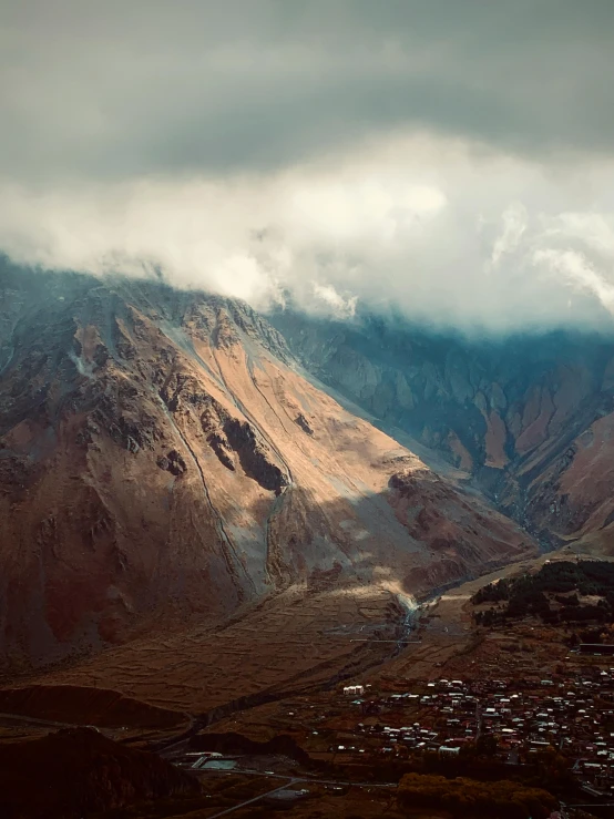 an empty valley under an overcast sky