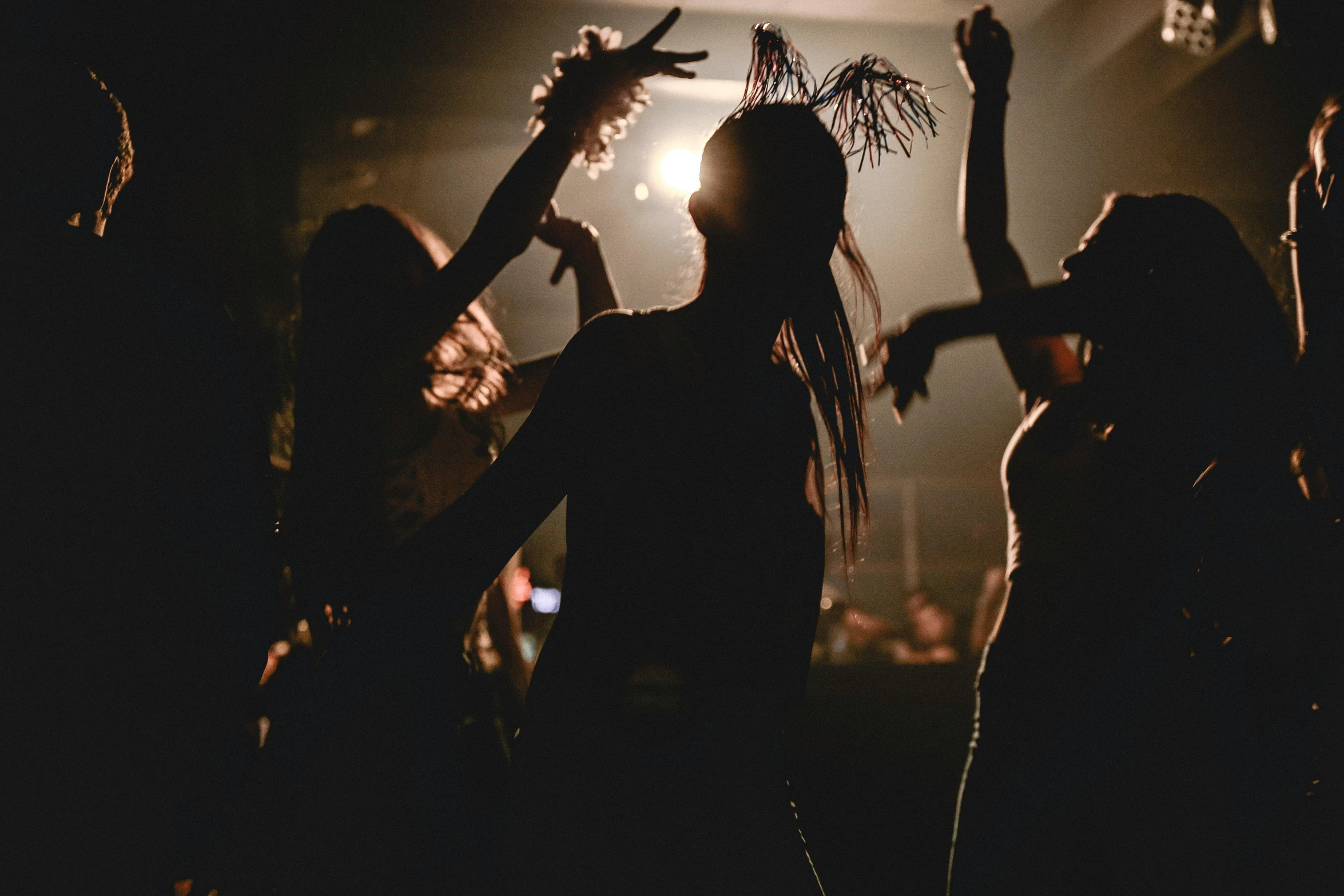 a group of people that are standing in the dark, other women dancing behind, clubs, profile image, tassels