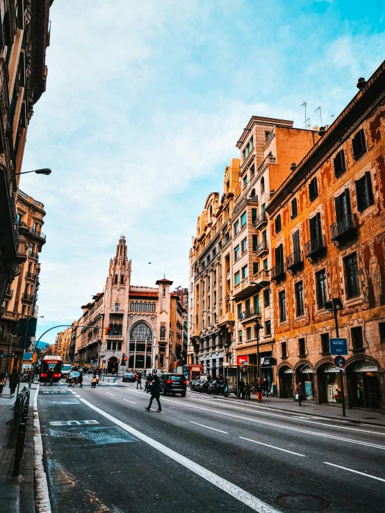 a city street filled with lots of tall buildings, inspired by Modest Urgell, pexels contest winner, art nouveau, gothic quarter, thumbnail, golden, conde nast traveler photo