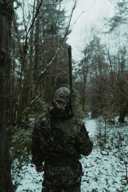 a man that is standing in the snow with a gun, an album cover, inspired by Elsa Bleda, pexels contest winner, renaissance, swamp thing, camo, hunting trophies, subject= duck