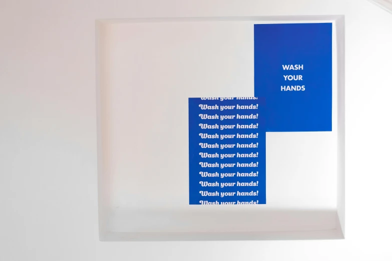 a blue and white sign that says wash your hands, an album cover, inspired by Donald Judd, interactive art, dezeen showroom, product display photograph, high transparency, close up front view