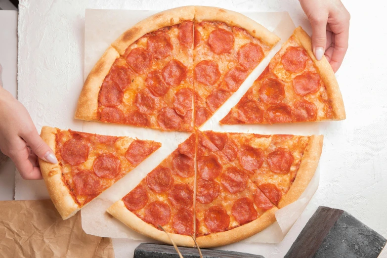 a person holding a slice of pepperoni pizza, trending on pexels, hyperrealism, parchment paper, 6 pack, a high angle shot, 2 5 6 x 2 5 6 pixels