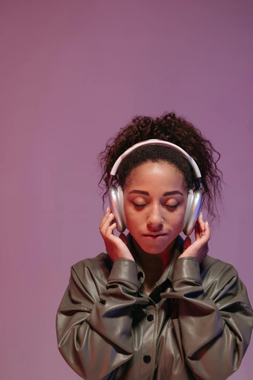 a close up of a person wearing headphones, trending on pexels, aestheticism, mixed-race woman, focus on full - body, plain background, bisexual lighting