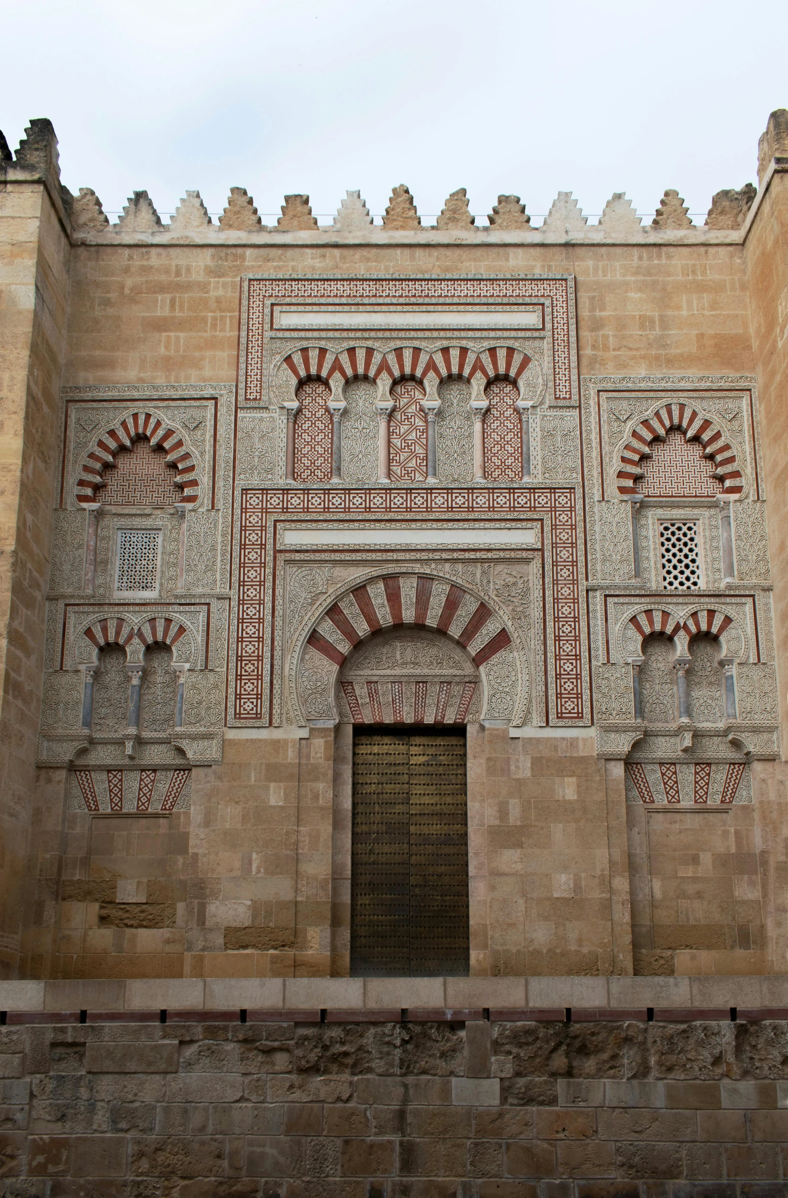 a large building with a clock on the front of it, inspired by Luis Paret y Alcazar, arabesque, door, minarets, detiled, very interesting