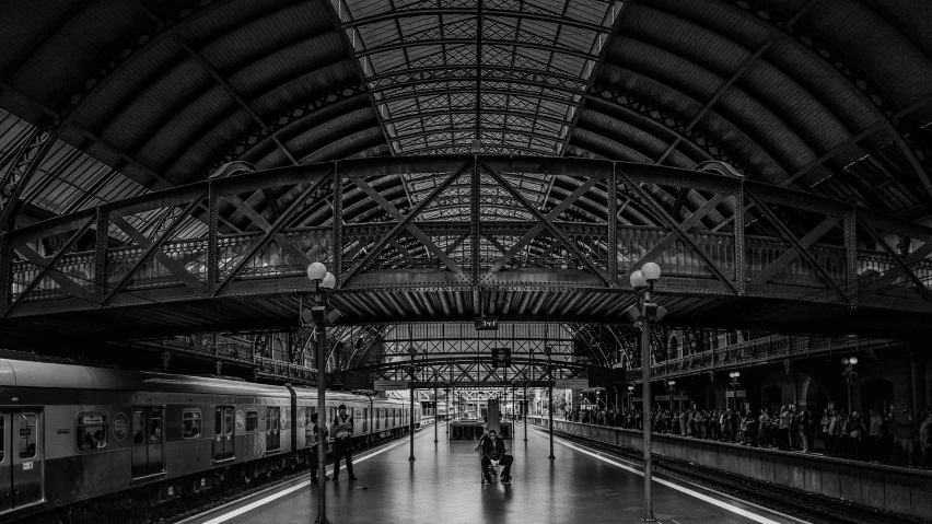 a black and white photo of a train station, by Daniel Seghers, pexels contest winner, symmetrical!!!, andreas rocha style, boston, confortable atmosphere