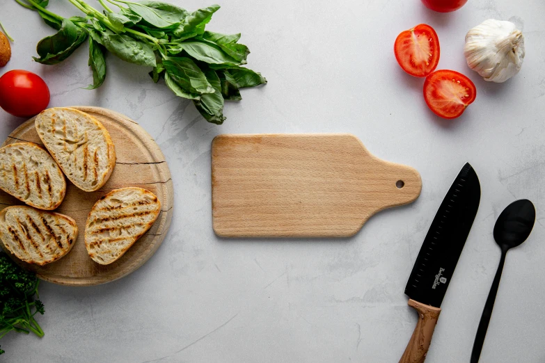 a wooden cutting board sitting on top of a table, a still life, by Robbie Trevino, spatula, light wood, bright natural light, rectangle