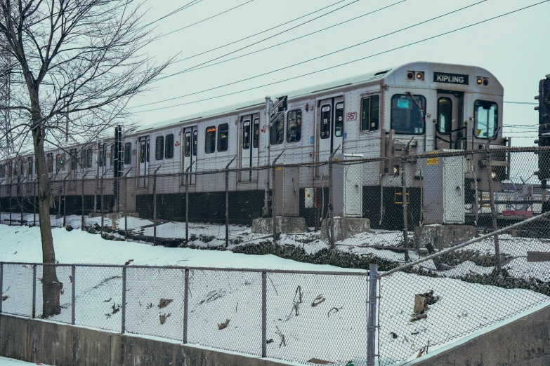 a train that is on the tracks in the snow, a colorized photo, inspired by Washington Allston, unsplash, graffiti, subways, 🚿🗝📝, panoramic shot, grey