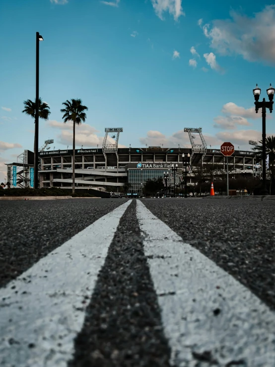 a road with a white striped at the bottom