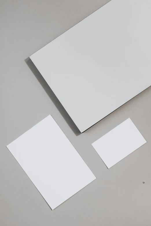 a bunch of papers sitting on top of a table, metal panels, titanium white, thumbnail, rectangle