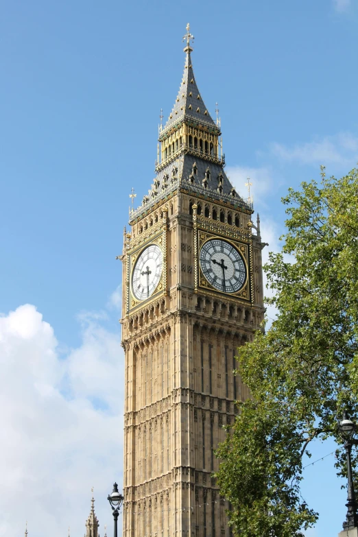 the big ben clock tower towering over the city of london, by David Simpson, sunny day, round-cropped, top, square