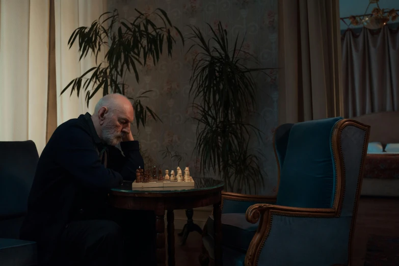 a man sitting at a table playing a game of chess, an album cover, by Adam Marczyński, unsplash contest winner, hyperrealism, portrait of sigmund freud, she's sad, 15081959 21121991 01012000 4k, still image from tv series