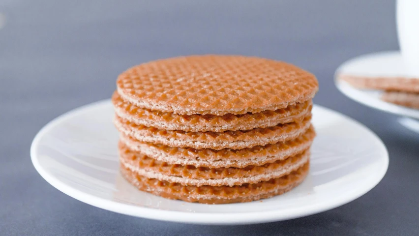 a stack of cookies sitting on top of a white plate, pexels, rubber waffle outsole, spain, hexagonal shaped, extra crisp image