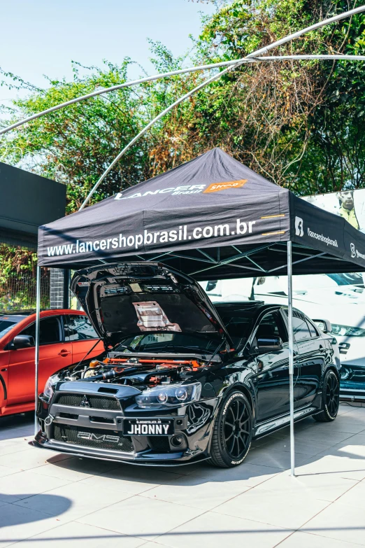 a group of cars parked next to each other under a canopy, by Emerson Silva, fanbox, banner, tuning, official store photo