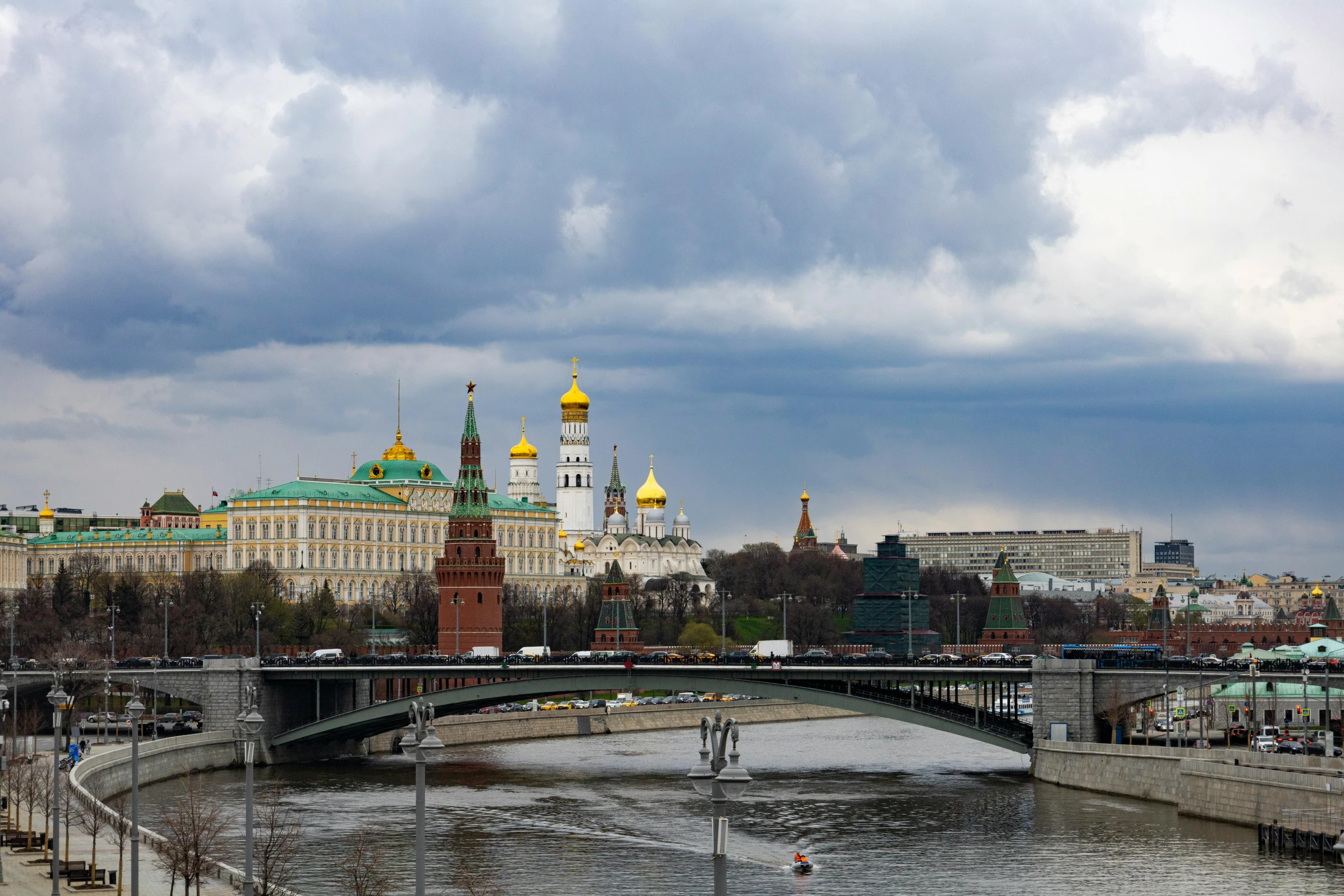 a bridge over a river with buildings in the background, an album cover, inspired by Vasily Surikov, pexels contest winner, socialist realism, kremlin, on a cloudy day, brown, 000 — википедия