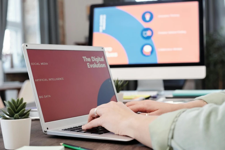 a person typing on a laptop on a desk, a digital rendering, trending on pexels, evolution, 9 9 designs, digital billboards, round format