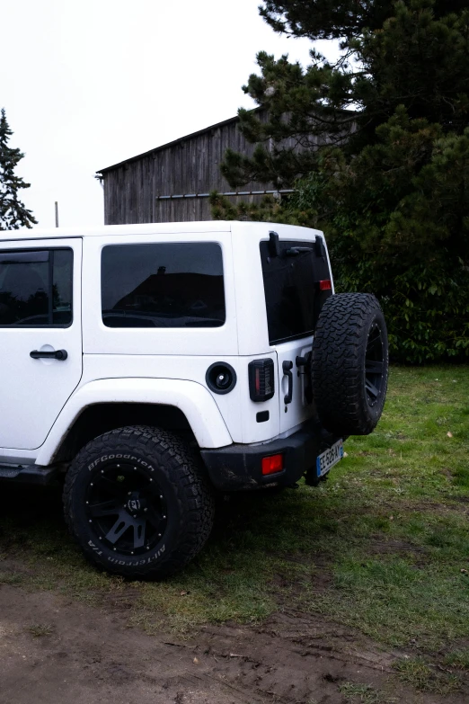 this is a white jeep with two large tires