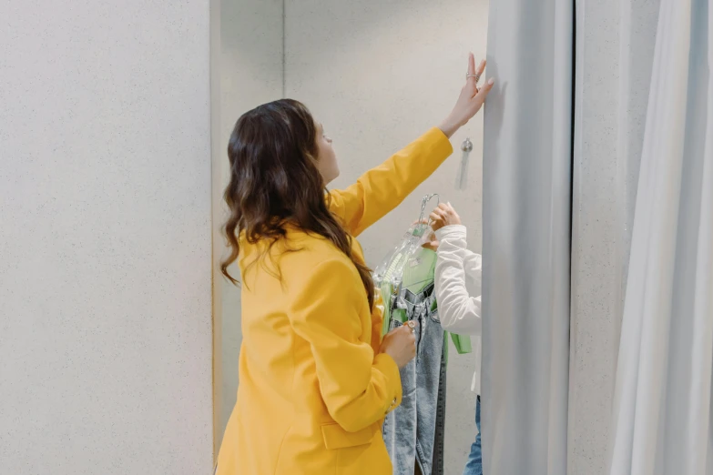 a girl touching the closet on a mirror