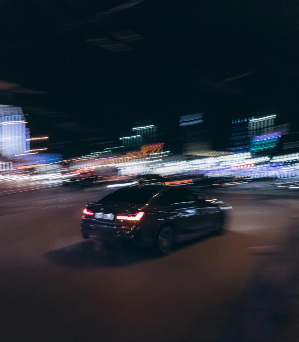 a dark picture with lights of various cars driving at night