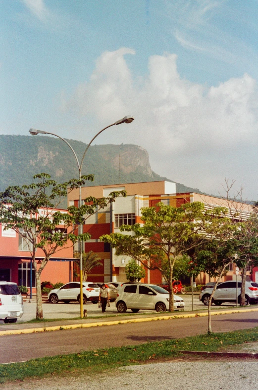 this is a city street with mountains in the background