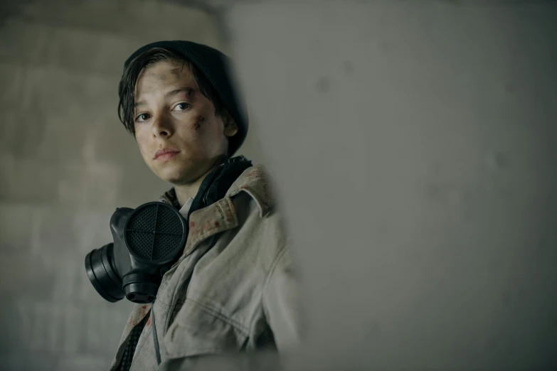 a close up of a person with a camera, by Emma Andijewska, pexels contest winner, graffiti, wearing ripped dirty flight suit, still from stranger things, young female ww 2 soldier, teenage boy