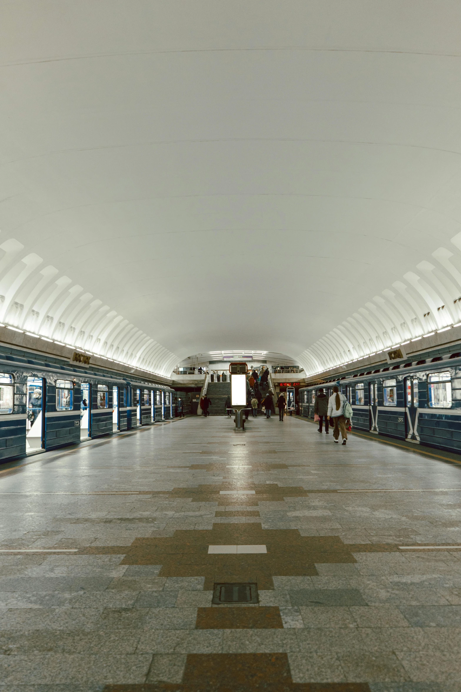 this is an image of people standing inside the metro