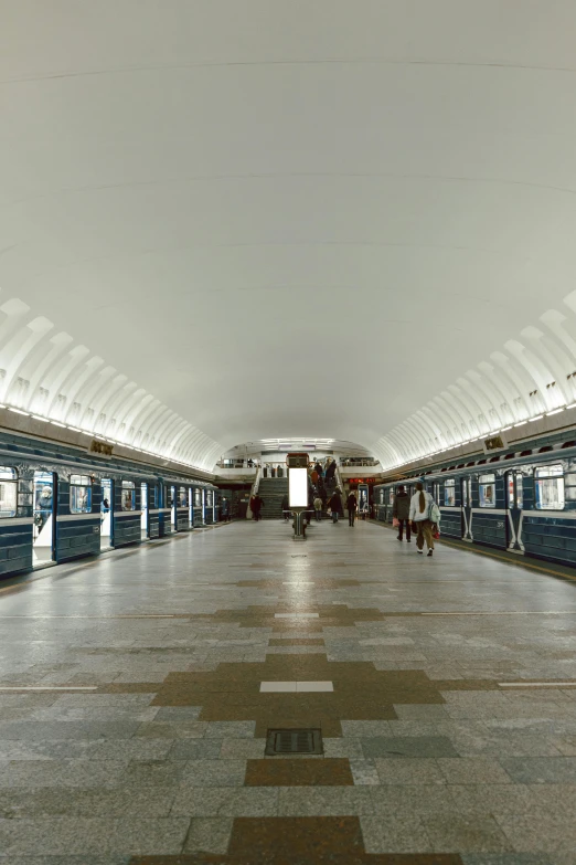 this is an image of people standing inside the metro