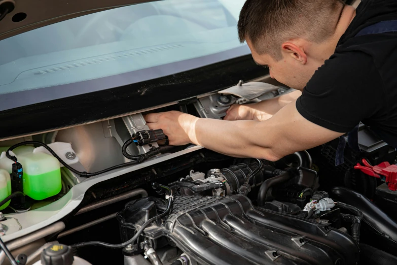 a man working on a car engine, a picture, by Adam Marczyński, shutterstock, 15081959 21121991 01012000 4k, instagram post, avatar image, wiring