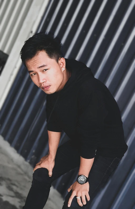 a man riding a skateboard up the side of a building, inspired by Ryan Yee, standing with a black background, handsome chad chin, asian face, profile image