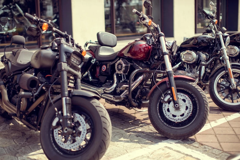 a row of motorcycles parked next to each other, a cartoon, pexels contest winner, harley davidson motorbike, exterior shot, hull, 🚿🗝📝