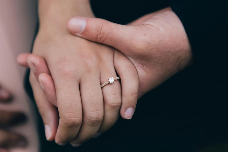 a close up of two people holding hands, by Arabella Rankin, pexels, man proposing his girlfriend, “diamonds, instagram post, a small