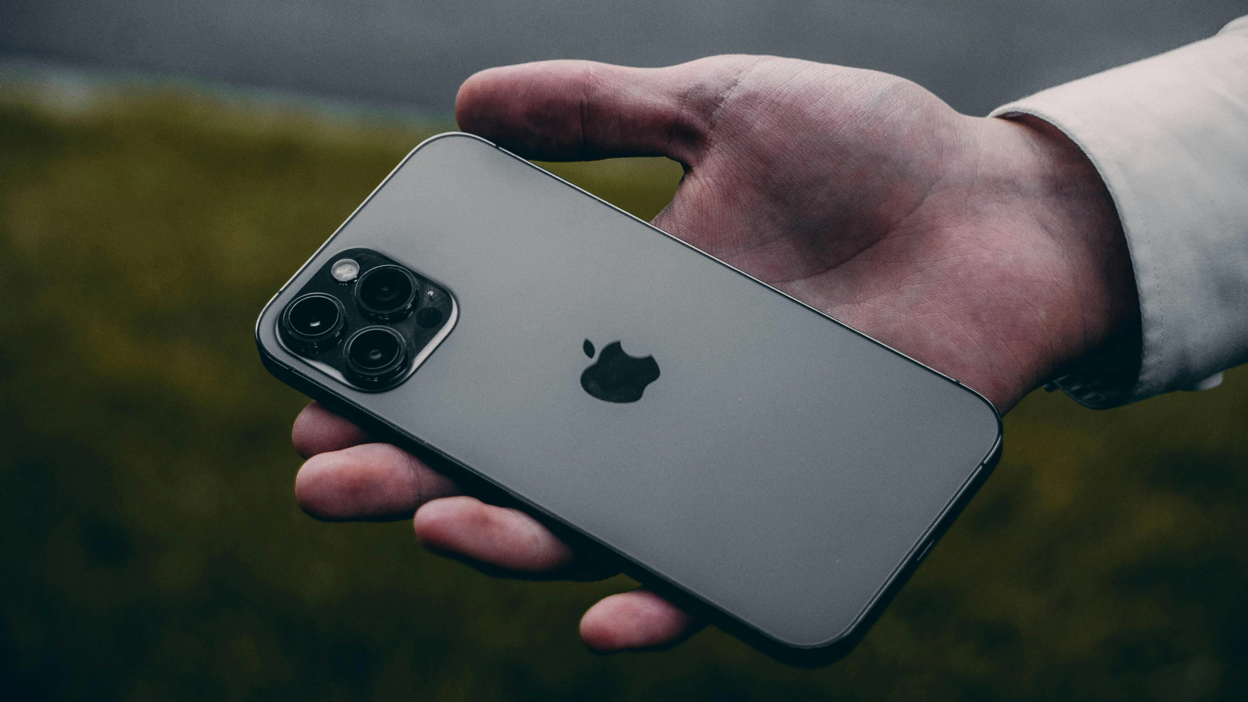 a person holding an iphone in their hand, pexels contest winner, square, iphone 12, solid grey, 555400831