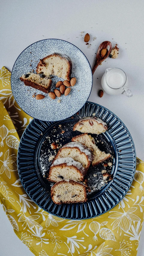 a couple of plates that have some food on them, a still life, by Alice Mason, pexels, rococo, the greatest cake, high resolution product photo, with a long, blue