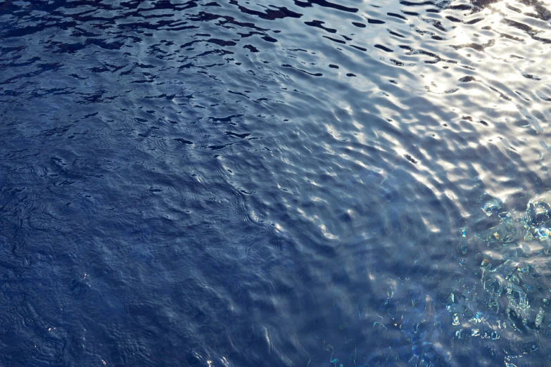 the water reflects the sun and makes patterns on it