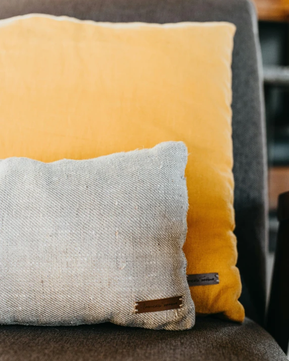 a pillow and a sofa cushion sitting on a chair