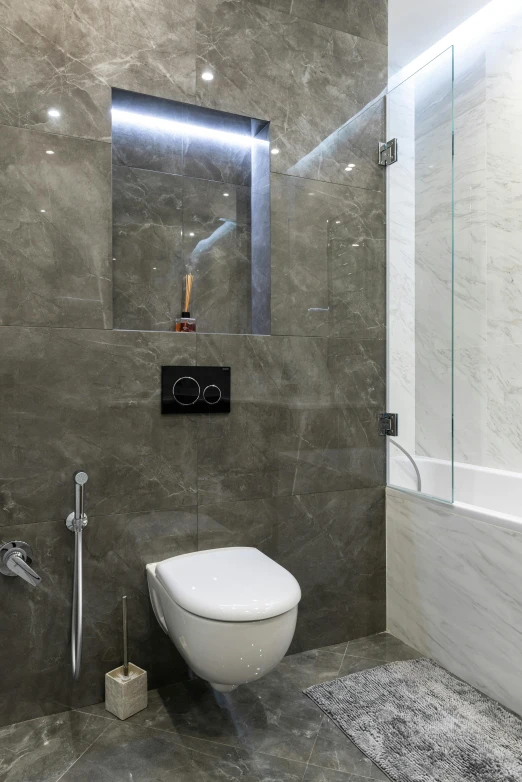 an all white bathroom with a toilet and shower