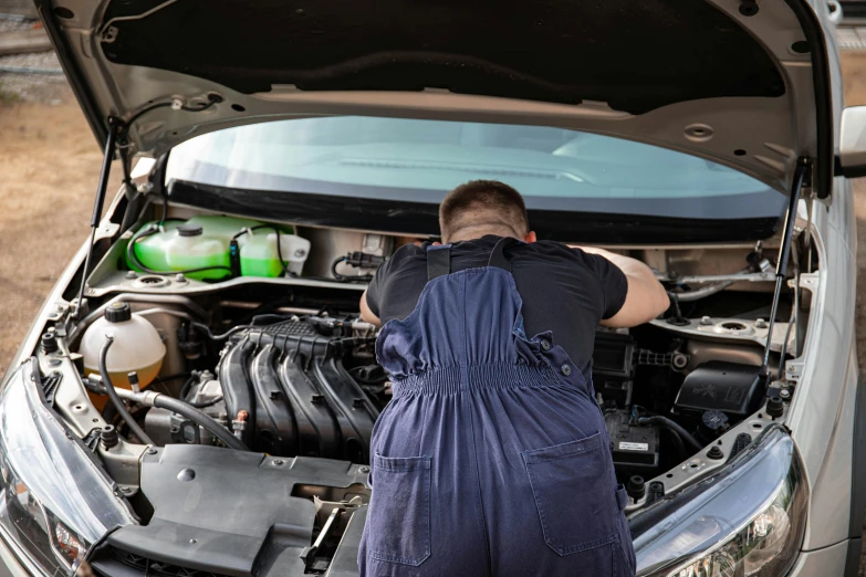 a man in overalls looking under the hood of a car, a picture, shutterstock, 15081959 21121991 01012000 4k, instagram post, hydraulics, pastel'