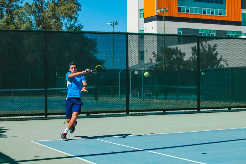 a man standing on a tennis court holding a racquet, action shots, university, profile image, shane prigmore