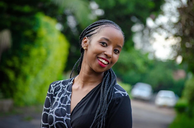 a woman with braids smiles at the camera, pexels contest winner, hurufiyya, avatar image, emmanuel shiru, doing an elegant pose, unmistakably kenyan