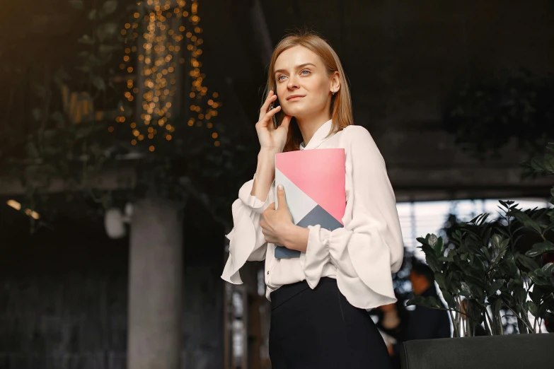 a woman in a white shirt and black pants talking on a cell phone, trending on pexels, renaissance, holding notebook, girl in suit, full colour, formal attire