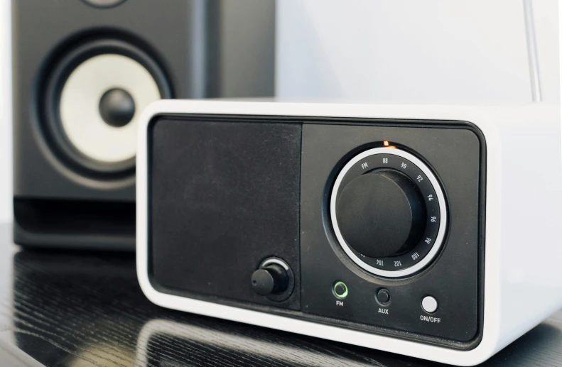 a pair of speakers sitting on top of a table