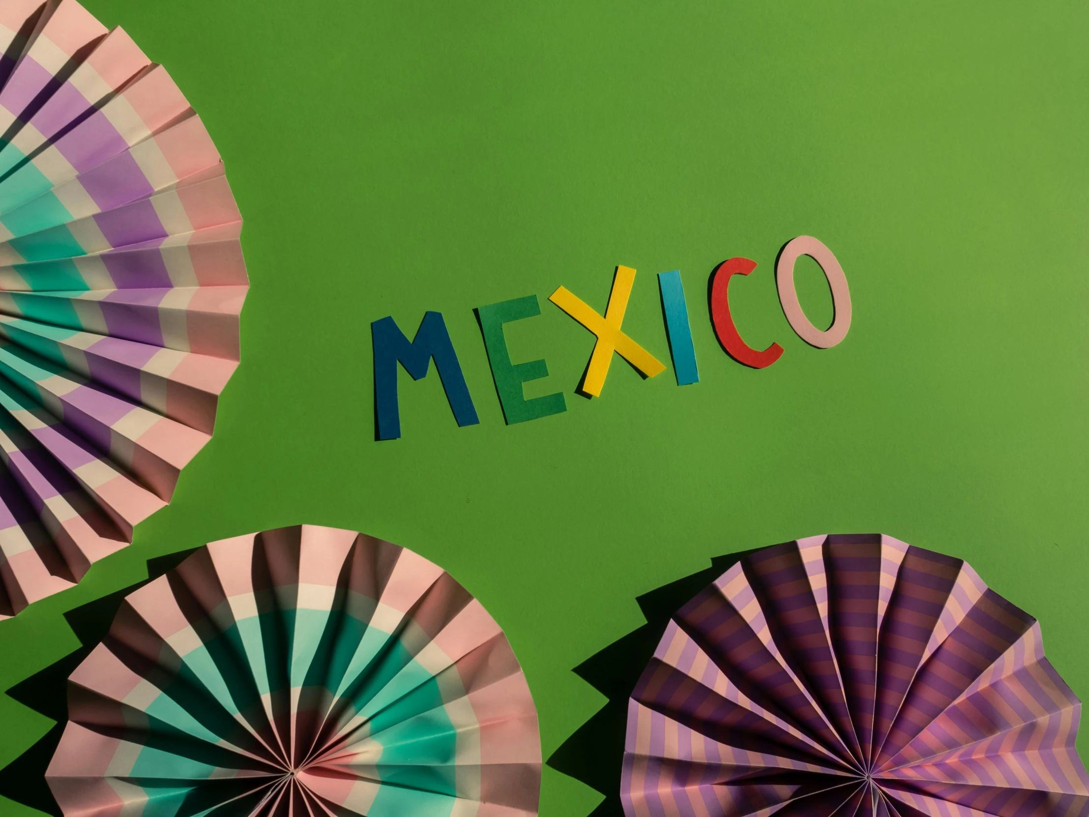 a group of umbrellas with the word mexico written on them, an album cover, by Rachel Reckitt, trending on pexels, papercraft, background image, studio product shot, olympics