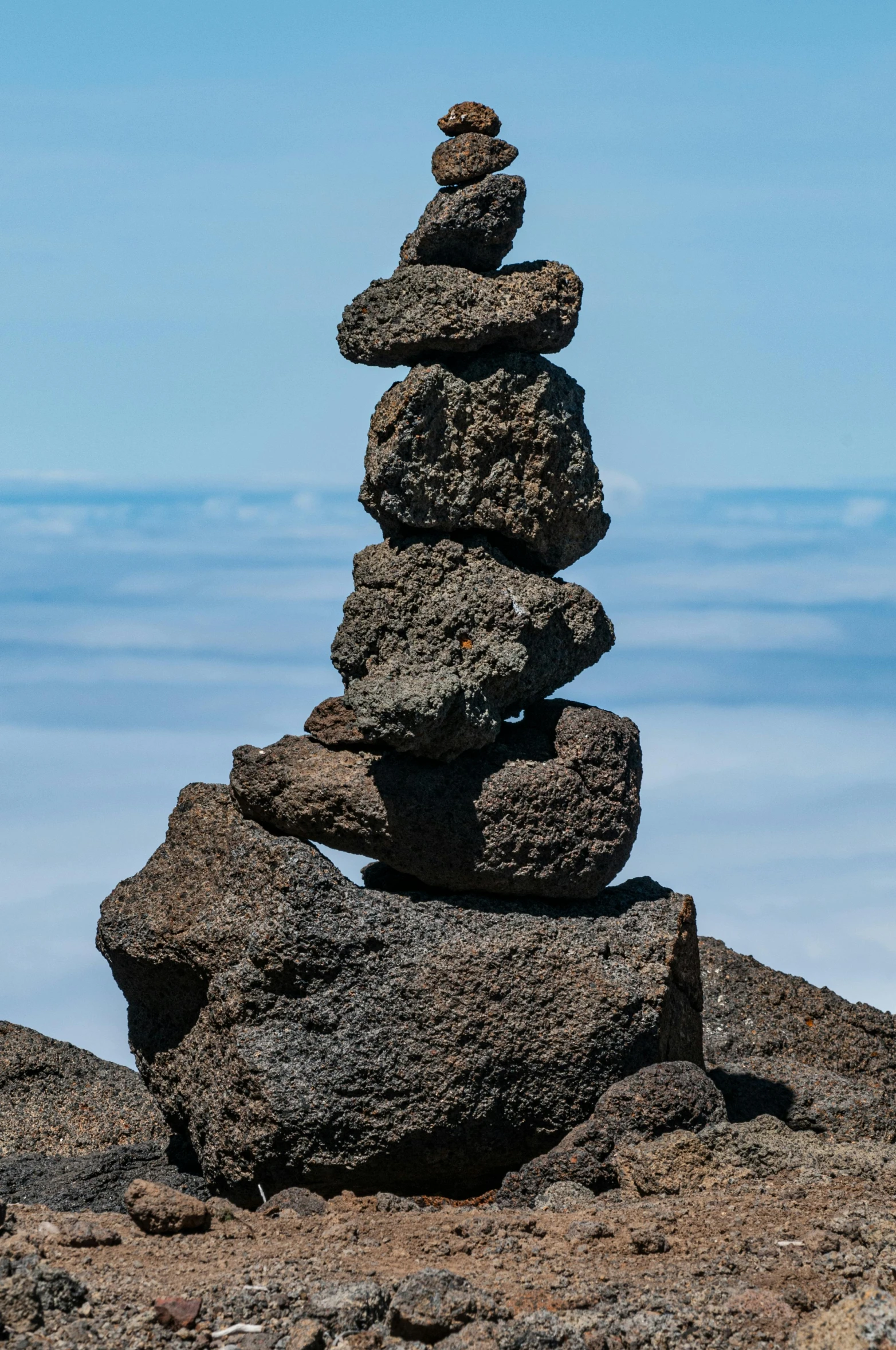 a stack of rocks sitting on top of a mountain, by Sven Erixson, big island, 8 k 4 k, high altitude, ((rocks))