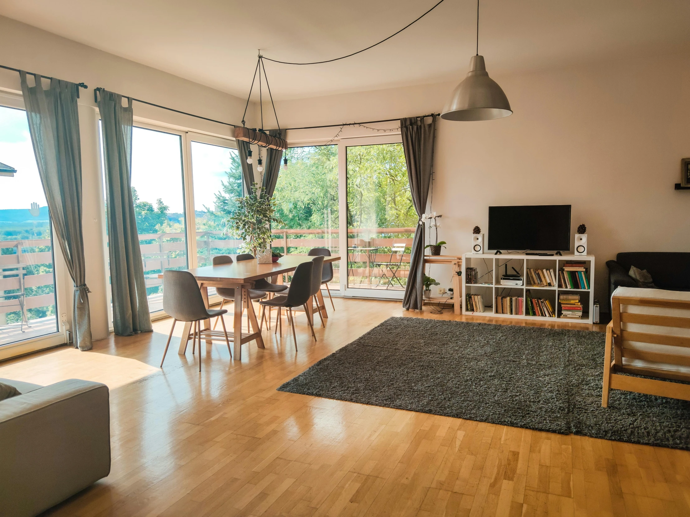 an apartment has wooden floors and a view